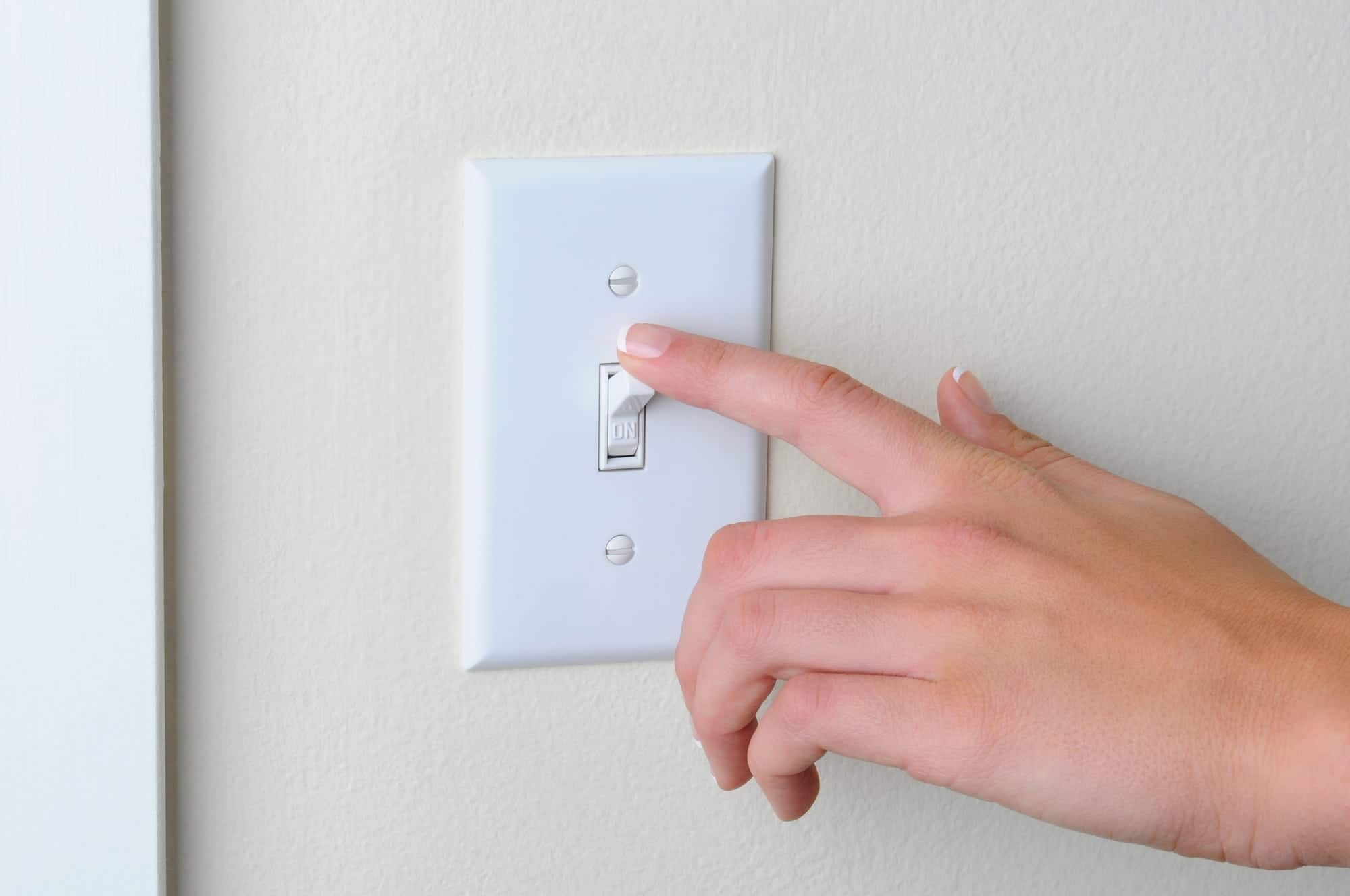 turning-off-on-light-switch-to-save-money